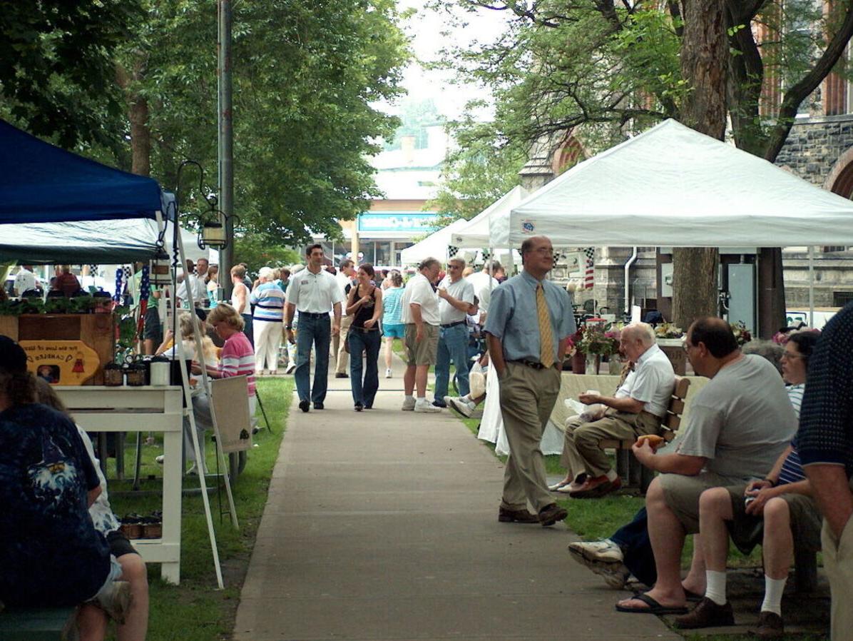 Community members walk through Wisner Market